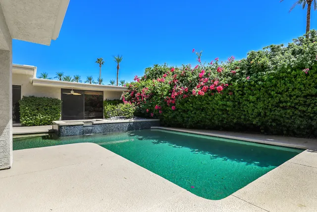 a view of a swimming pool and a fountain