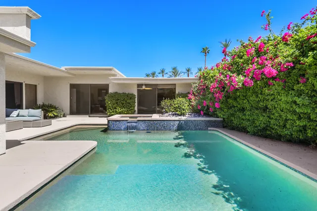 a view of a house with swimming pool