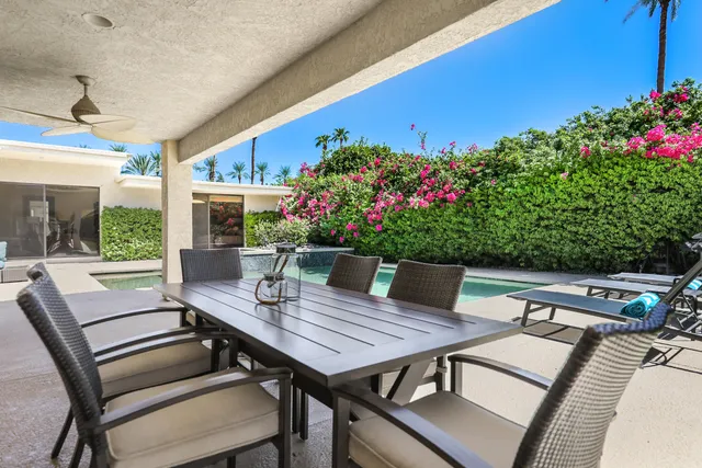 a view of a tables and chairs in patio