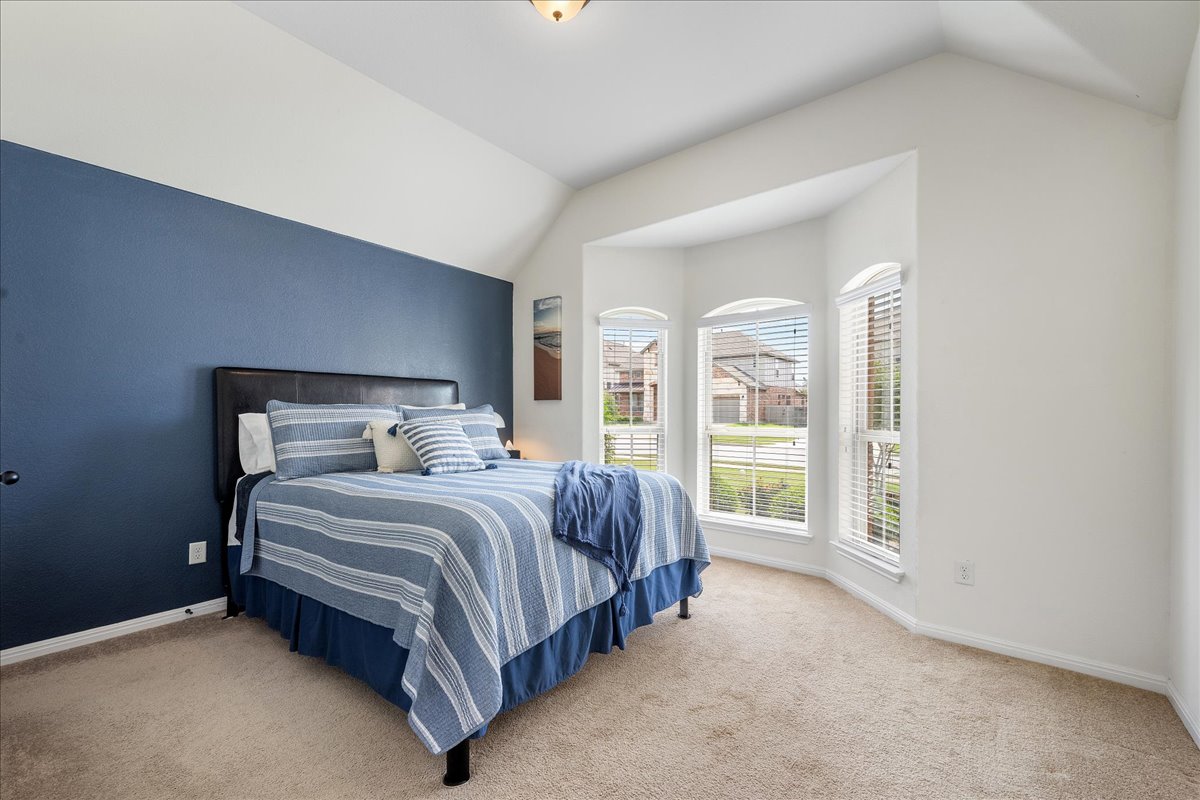 3000 Rio Verde Drive Leander, TX 78641 - Photo 15 of 23 a bed sitting in a spacious bedroom next to a large window