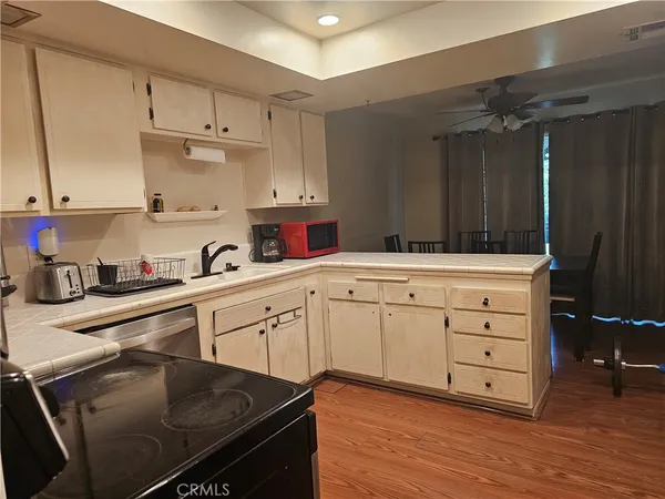 a kitchen with a stove a sink and a refrigerator