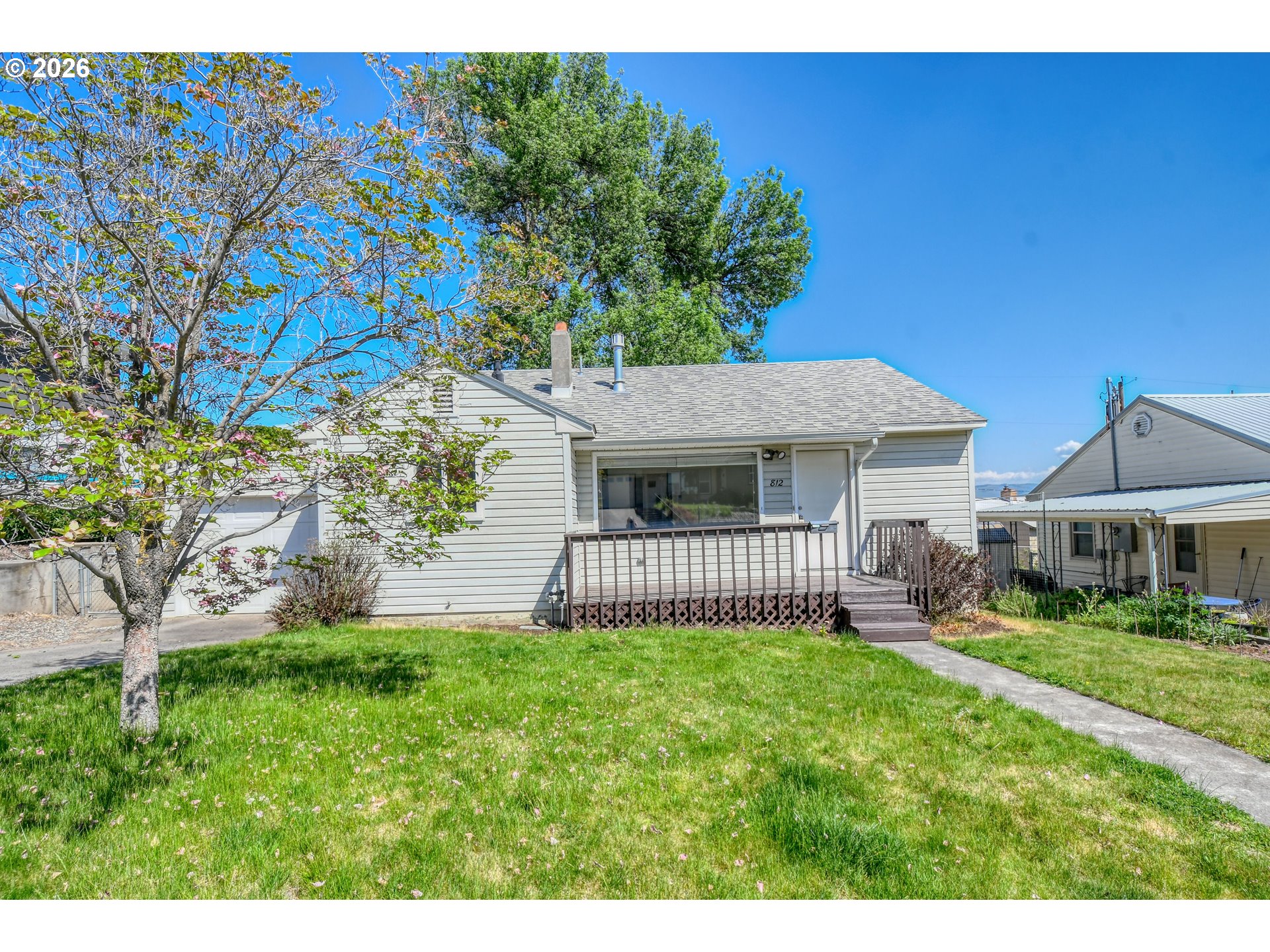 812 Northwest 11th Street Pendleton, OR 97801 - Photo 1 of 28 a front view of a house with a garden and plants