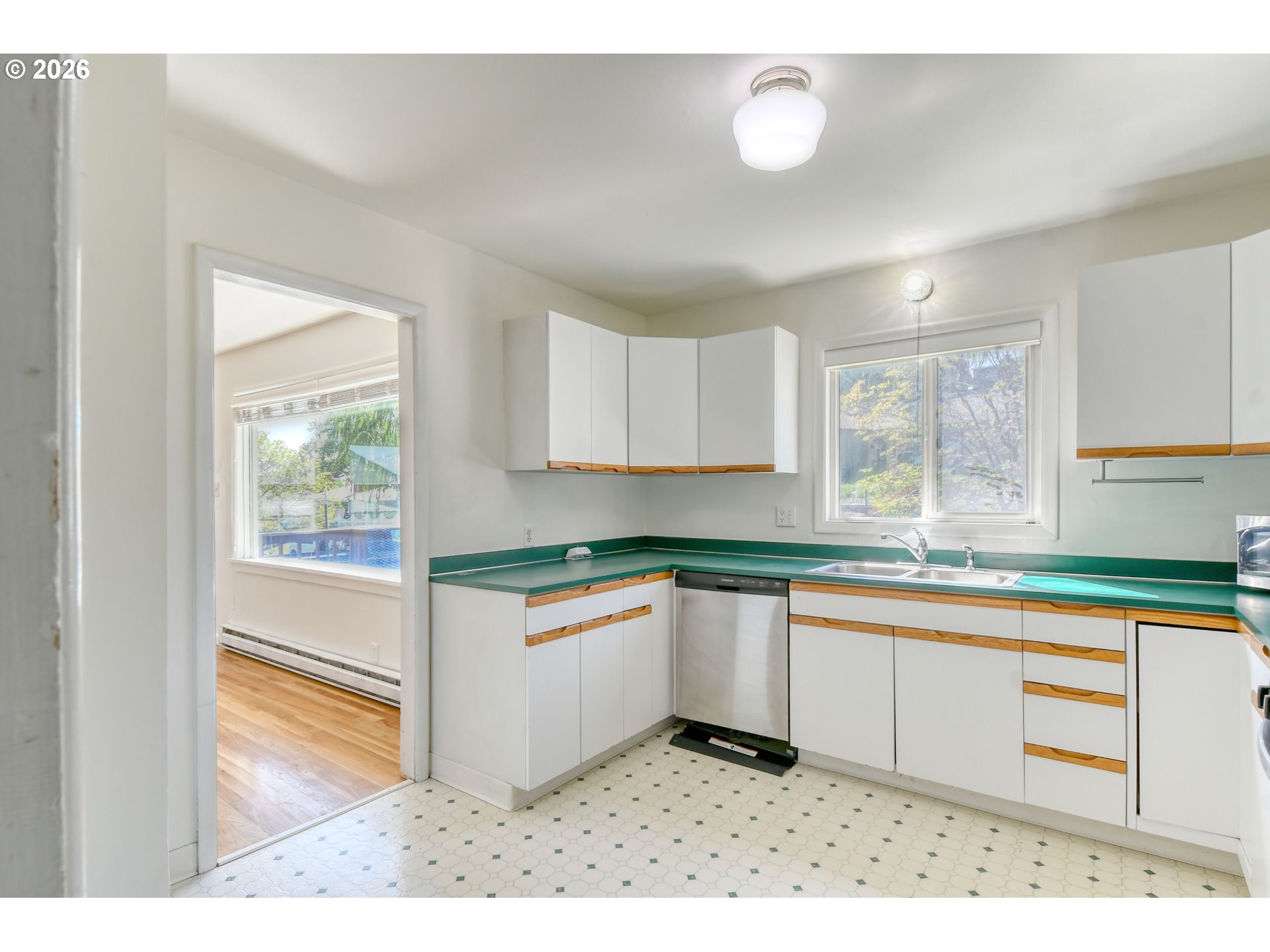 812 Northwest 11th Street Pendleton, OR 97801 - Photo 9 of 28 a kitchen with stainless steel appliances granite countertop a stove a sink and a microwave