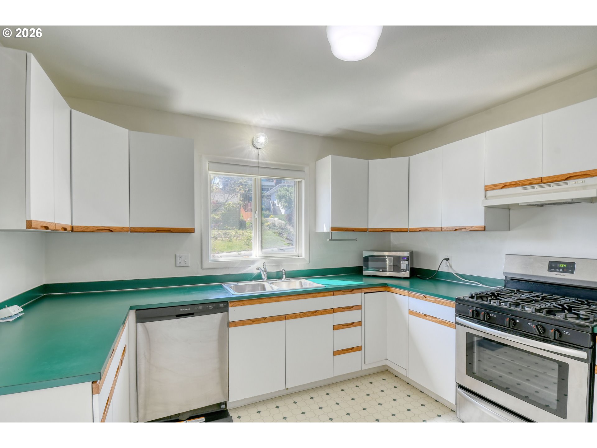 812 Northwest 11th Street Pendleton, OR 97801 - Photo 10 of 28 a kitchen with sink cabinets and window