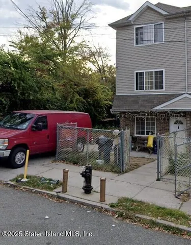 a front view of a house with parking space