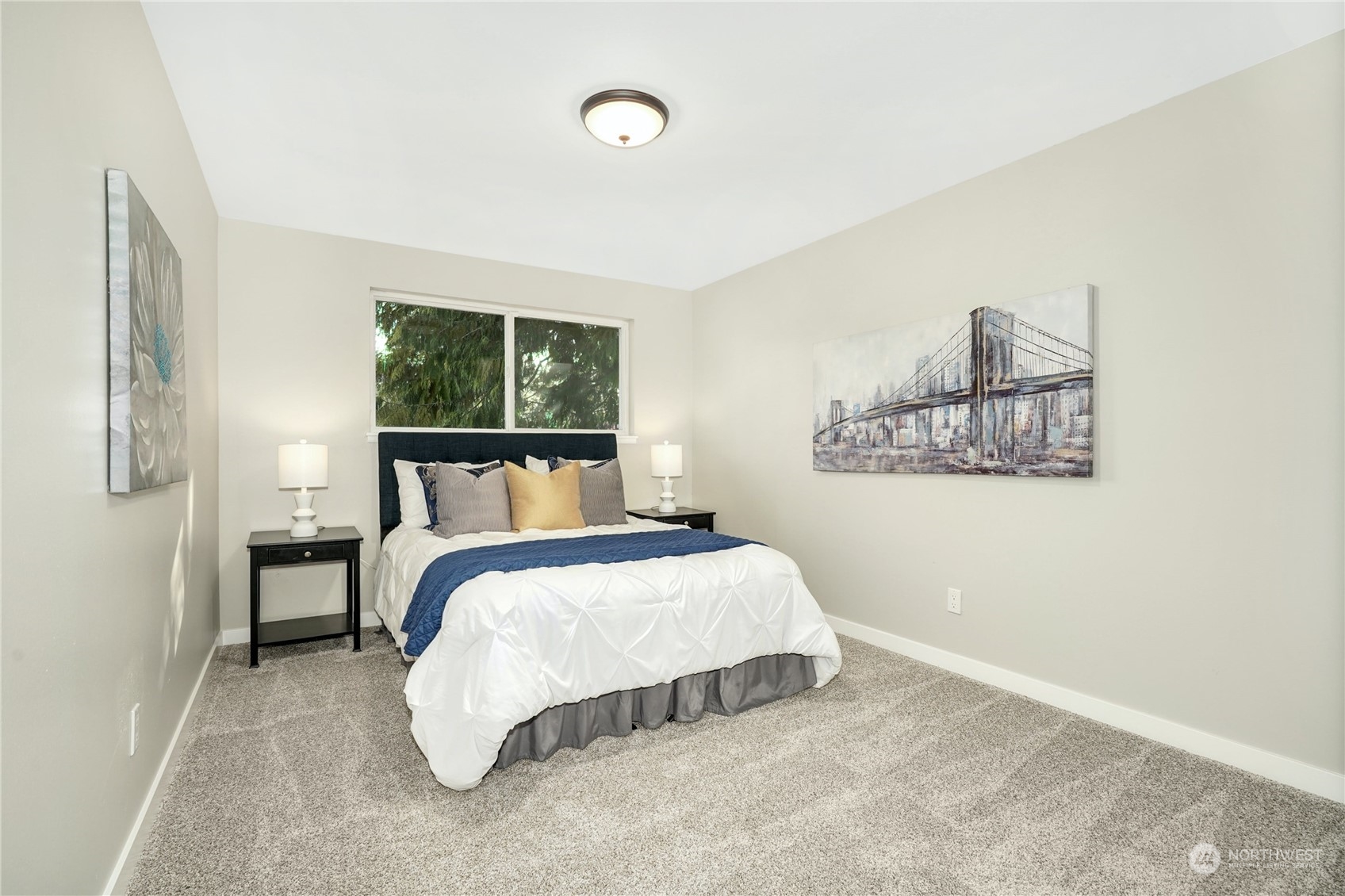 1821 Whitman Avenue Northeast Renton, WA 98059 - Photo 16 of 24 a bed sitting in a bedroom next to a window