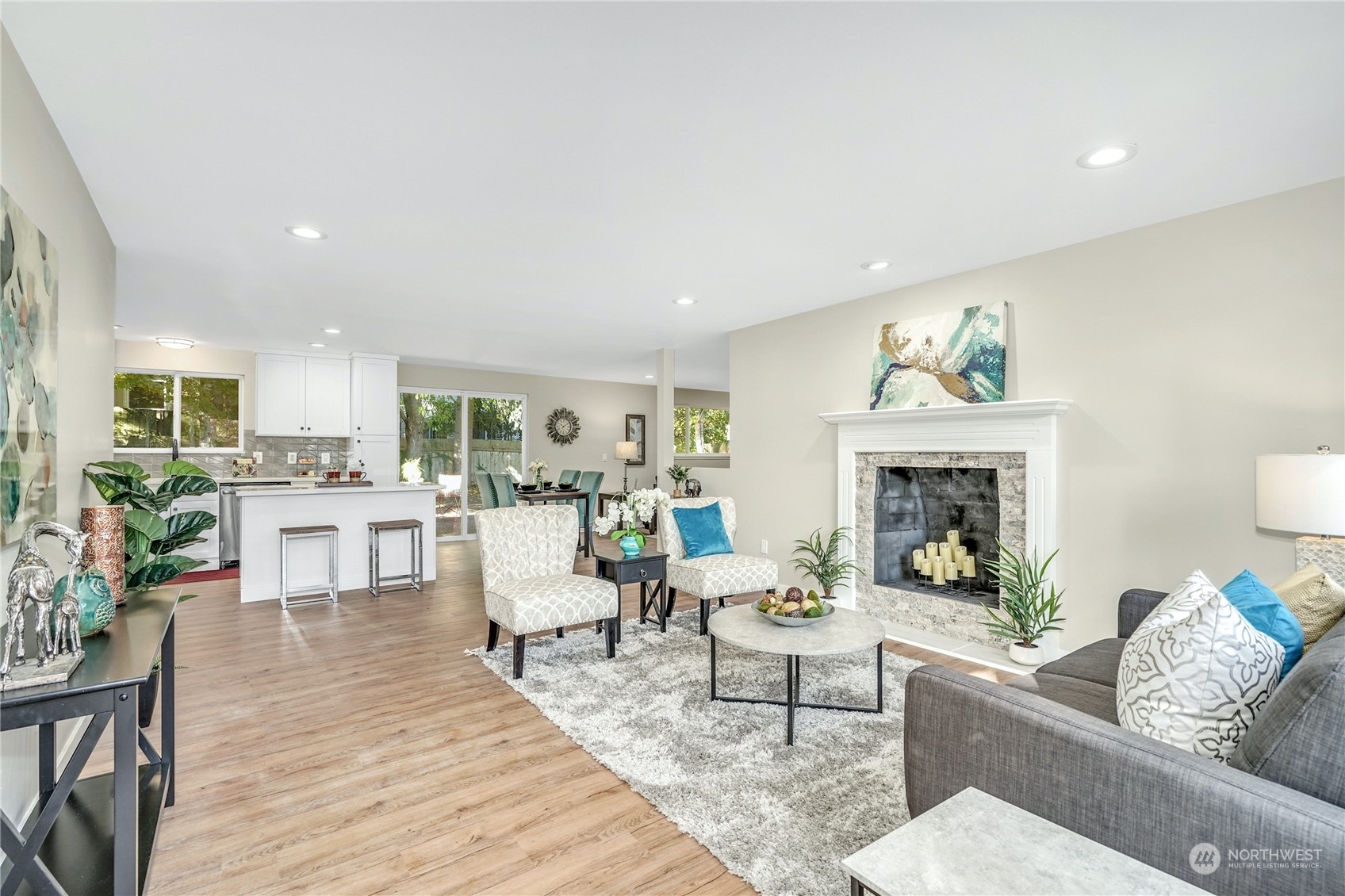 1821 Whitman Avenue Northeast Renton, WA 98059 - Photo 3 of 24 a living room with furniture and a fireplace