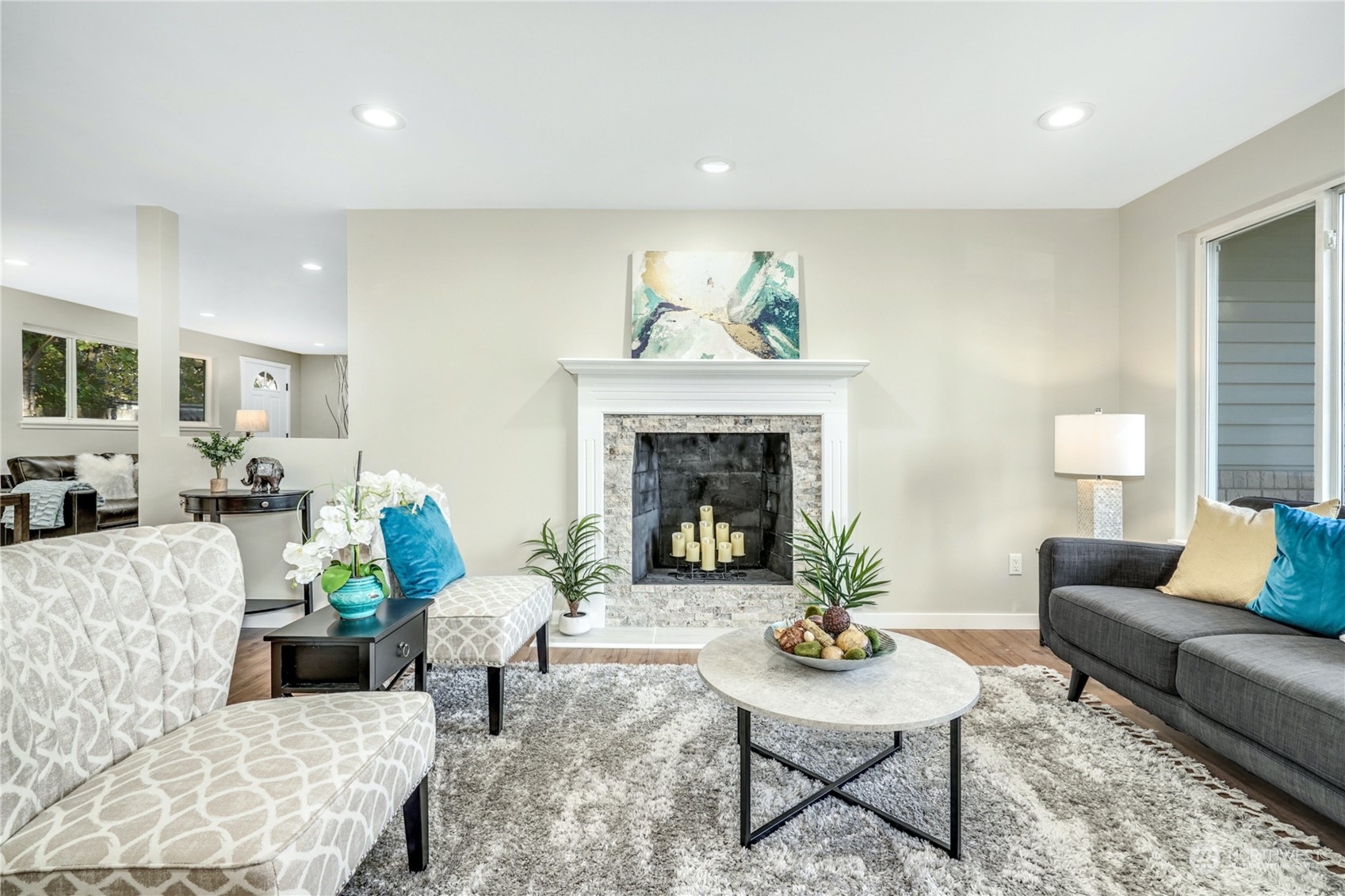 1821 Whitman Avenue Northeast Renton, WA 98059 - Photo 4 of 24 a living room with furniture and a fireplace