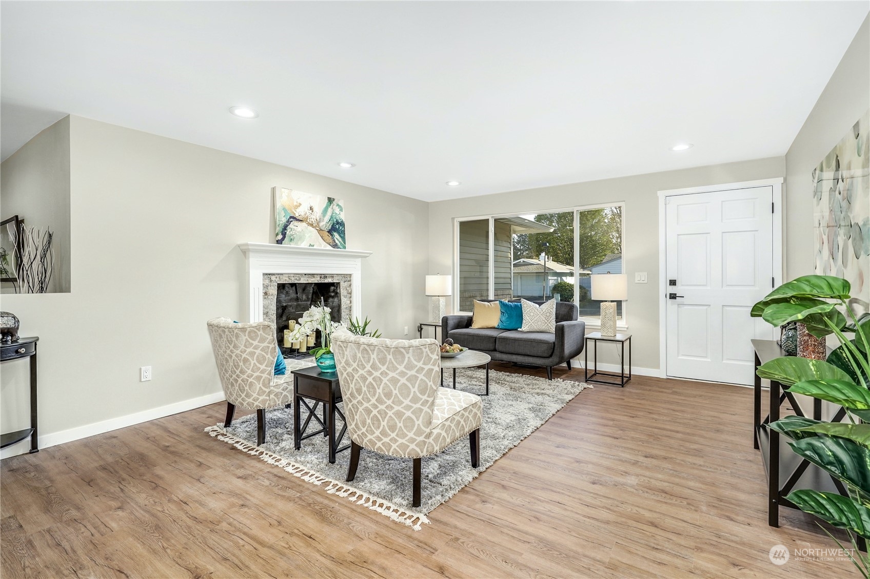 1821 Whitman Avenue Northeast Renton, WA 98059 - Photo 5 of 24 a living room with furniture and a fireplace