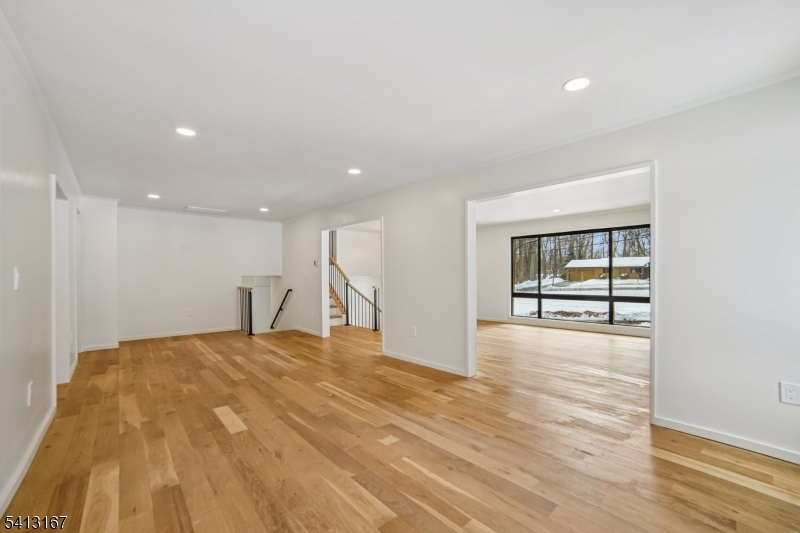 156 Park Road Parsippany, NJ 07054 - Photo 11 of 44 a view of an empty room with wooden floor and a window