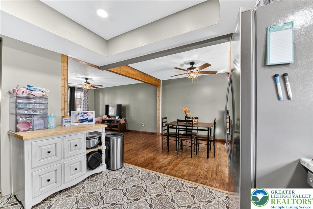 394 Manor Drive Nazareth, PA 18064 - Photo 16 of 44 a dining hall with stainless steel appliances kitchen island granite countertop a sink and cabinets