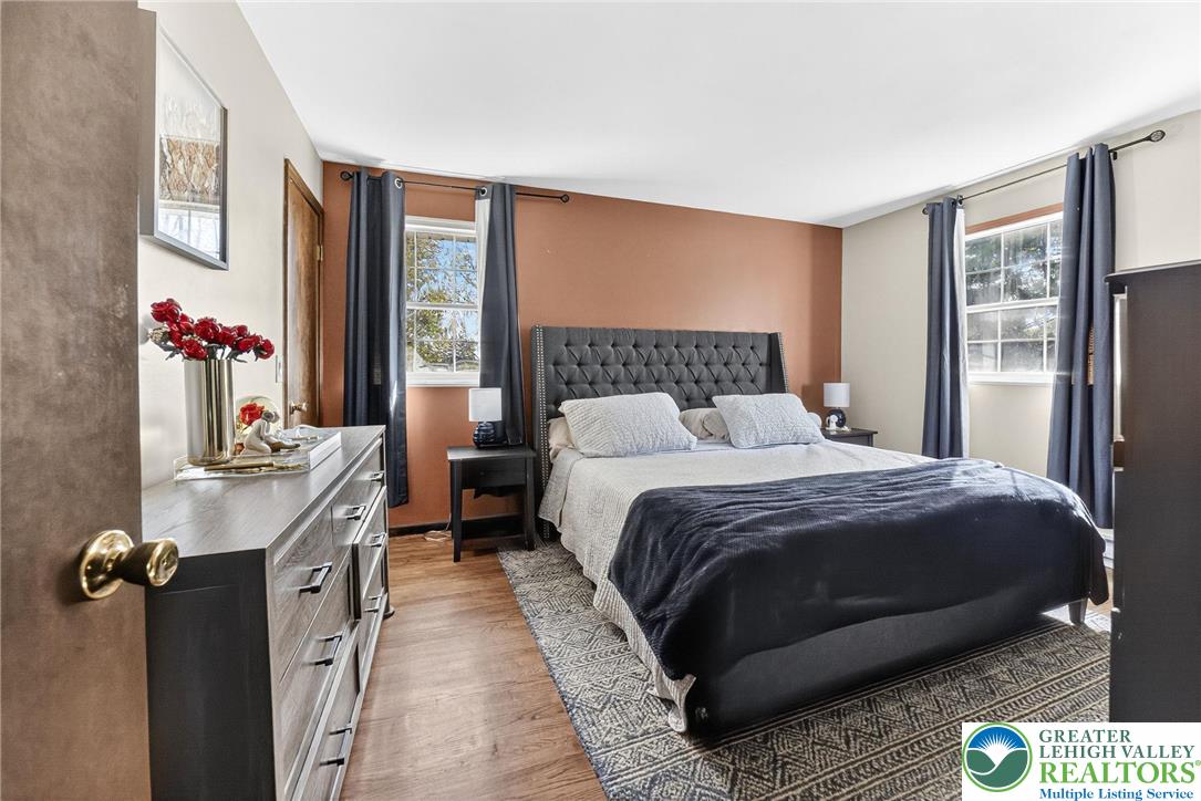 394 Manor Drive Nazareth, PA 18064 - Photo 21 of 44 a bedroom with a bed and a dresser next to a window