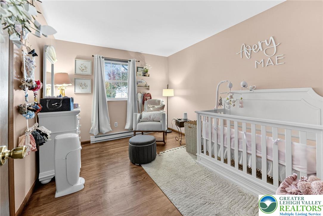 394 Manor Drive Nazareth, PA 18064 - Photo 24 of 44 a bedroom with furniture and a book shelf