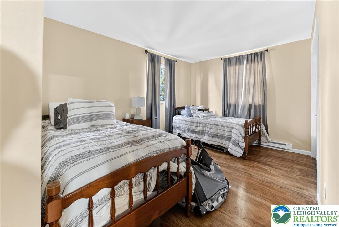 394 Manor Drive Nazareth, PA 18064 - Photo 26 of 44 a bedroom with two beds and wooden floor