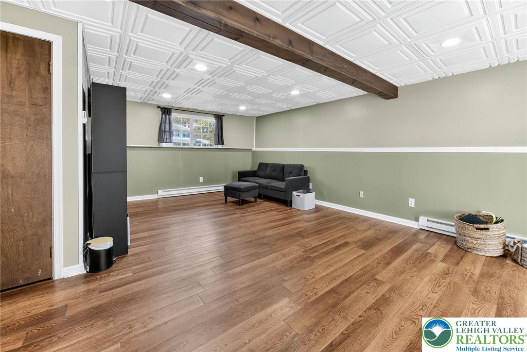 394 Manor Drive Nazareth, PA 18064 - Photo 28 of 44 a room with wooden floor and furniture