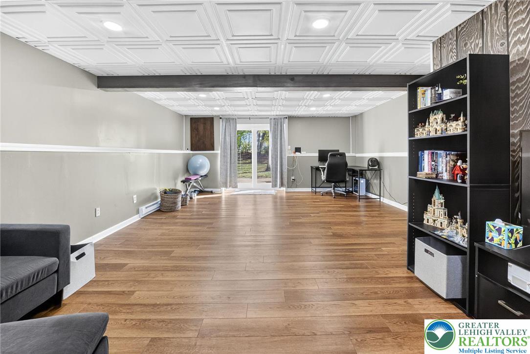 394 Manor Drive Nazareth, PA 18064 - Photo 30 of 44 a room with lots of furniture and a book shelf