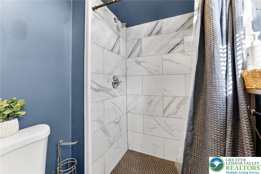 394 Manor Drive Nazareth, PA 18064 - Photo 33 of 44 a bathroom with a shower and a toilet