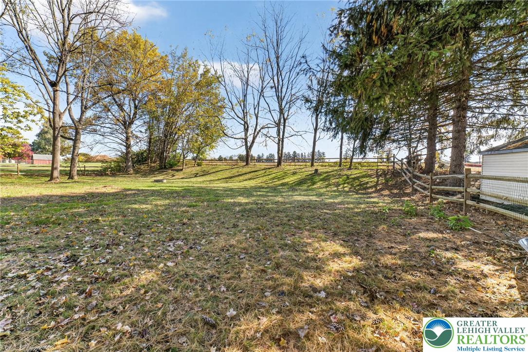 394 Manor Drive Nazareth, PA 18064 - Photo 39 of 44 a yard with trees in the background