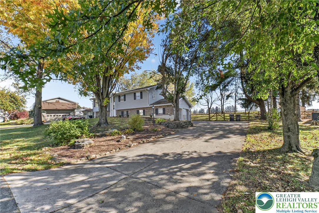 394 Manor Drive Nazareth, PA 18064 - Photo 6 of 44 a tree in front of a white house