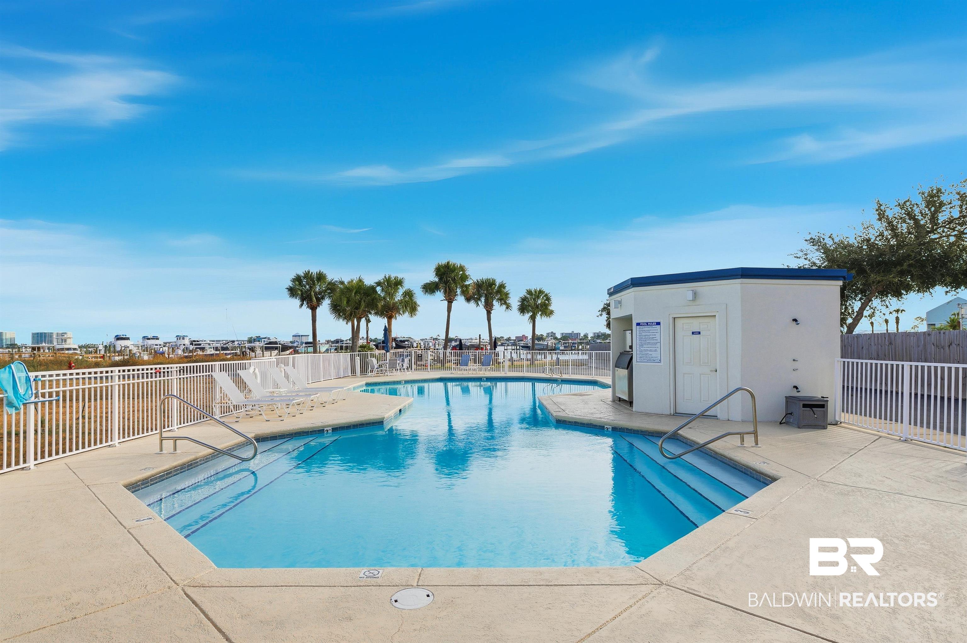 27282 Canal Road, Unit 408 Orange Beach, AL 36561 - Photo 28 of 37 Community pool with a patio area and Ice Machine