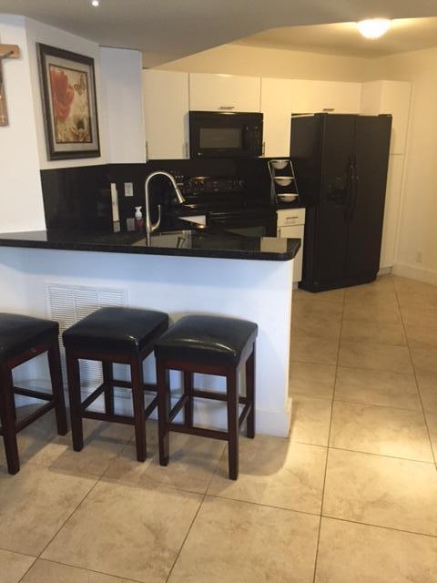 8761 Wiles Road, Unit 103 Coral Springs, FL 33067 - Photo 1 of 10 kitchen