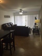 8761 Wiles Road, Unit 103 Coral Springs, FL 33067 - Photo 2 of 10 livingroom