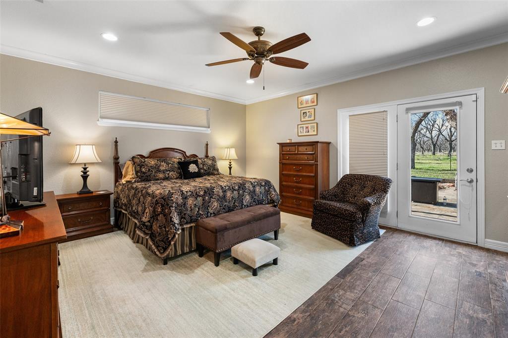 8903 Ravenswood Road Granbury, TX 76049 - Photo 17 of 36 Primary Retreat Featuring Hardwood Floors & Private Access To The Flagstone Patio