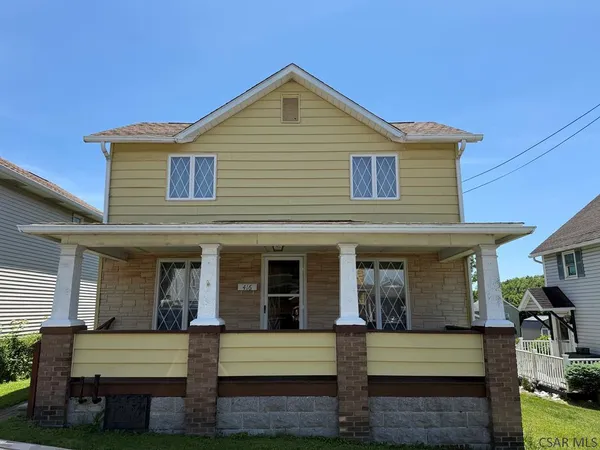 a front view of a house with a porch