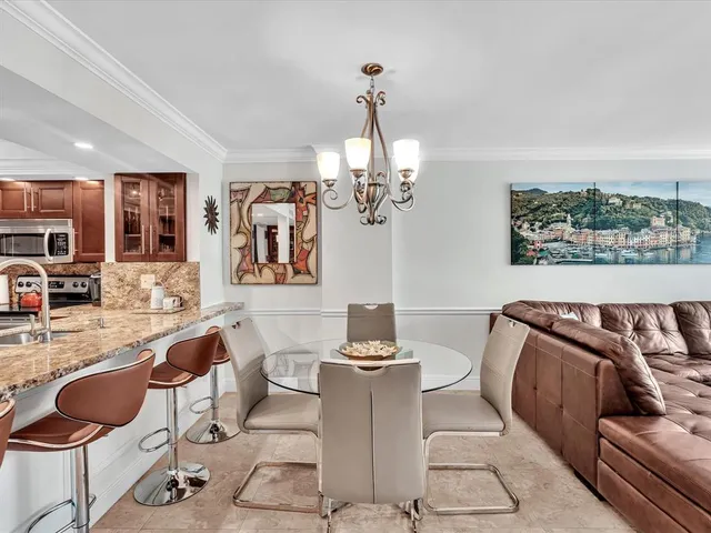 a living room with furniture a couch and a flat screen tv