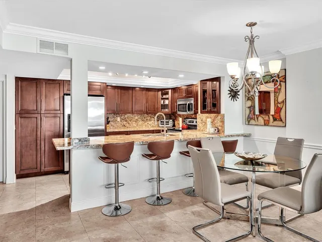 a living room with furniture a flat screen tv and a window