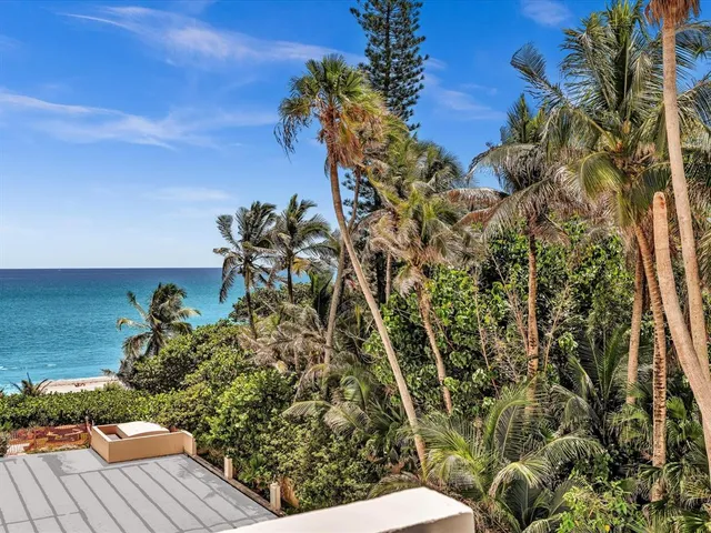 a bedroom with furniture and a flat screen tv