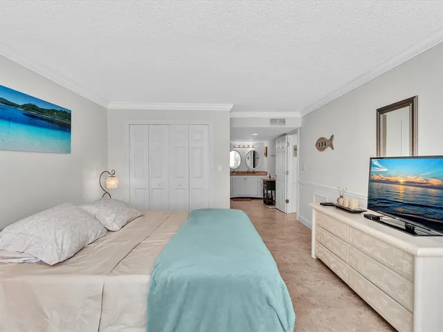 an aerial view of residential building and ocean view