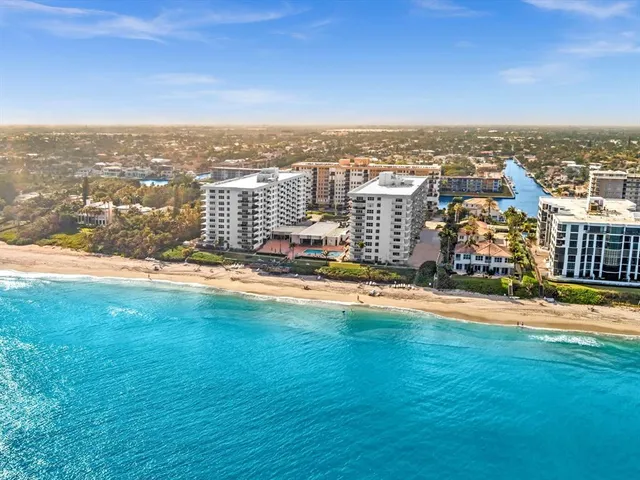 a room with pool table and windows