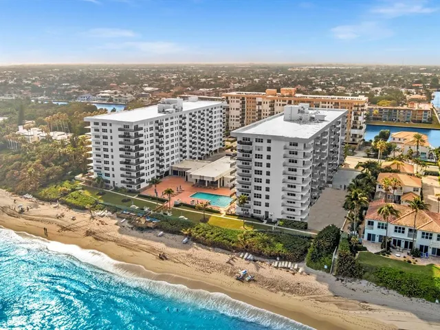 a room with pool table and windows