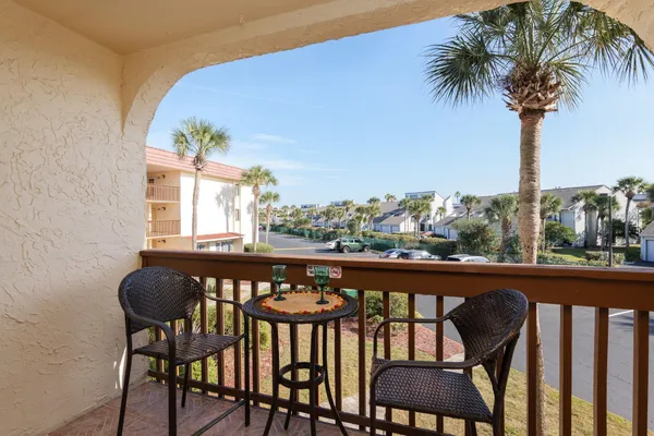 a view of a chairs and table in patio