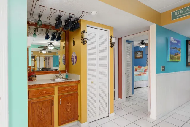 a bathroom with a sink a mirror and a shower