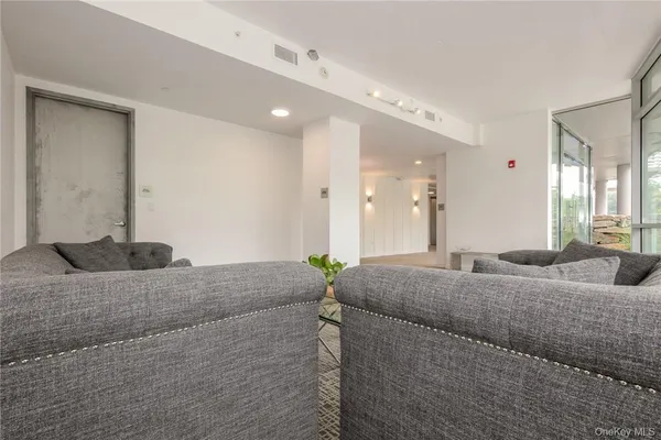 a living room with couches and painted walls