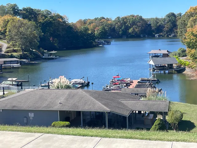 an aerial view of a house with a lake view