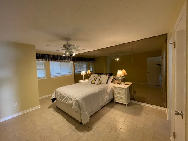 a bathroom with a sink mirror and a shower