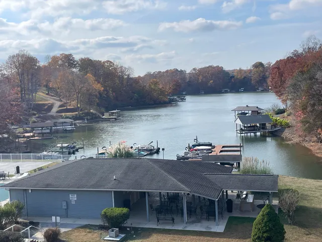 an aerial view of a house with lake view