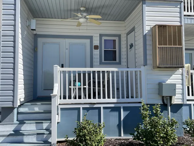 a view of a house with porch and wooden floor