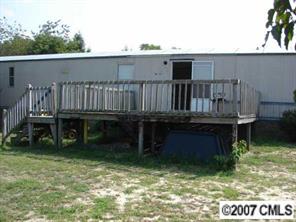 1360 Cason Oldfield Road Morven, NC 28119 - Photo 1 of 7 a view of a house with a balcony