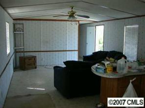 1360 Cason Oldfield Road Morven, NC 28119 - Photo 4 of 7 a living room with furniture and a fireplace