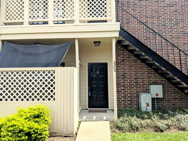 a front view of a house with a garage