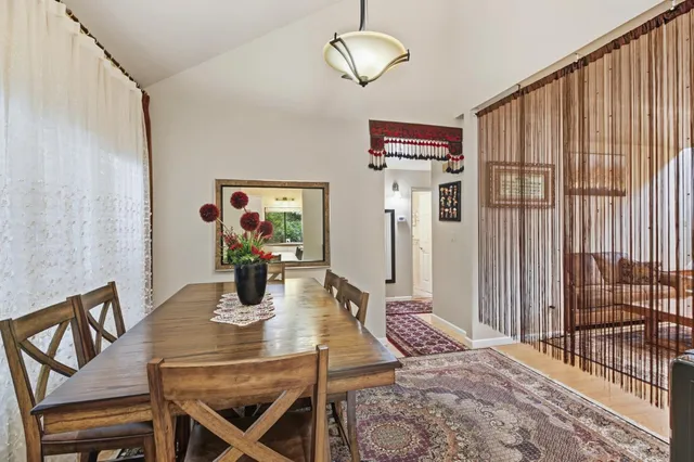 a view of a bedroom with wooden floor and cabinet