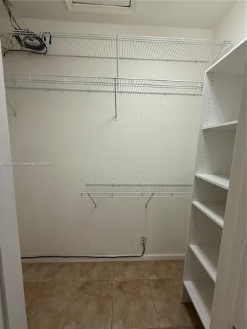 a view of an empty walk in closet