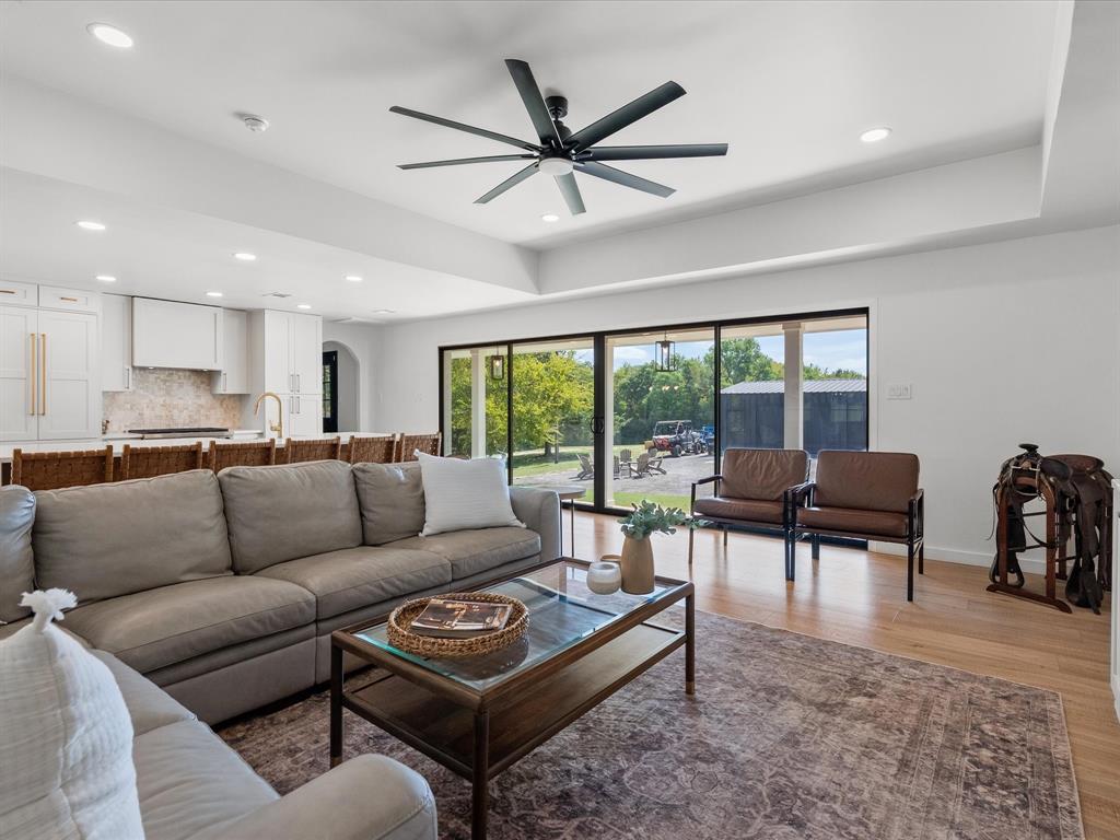 946 Burke Road Gunter, TX 75058 - Photo 7 of 38 Living room with detailed architecture walkways, light wood flooring, recessed lighting, ceiling fan, and a chandelier