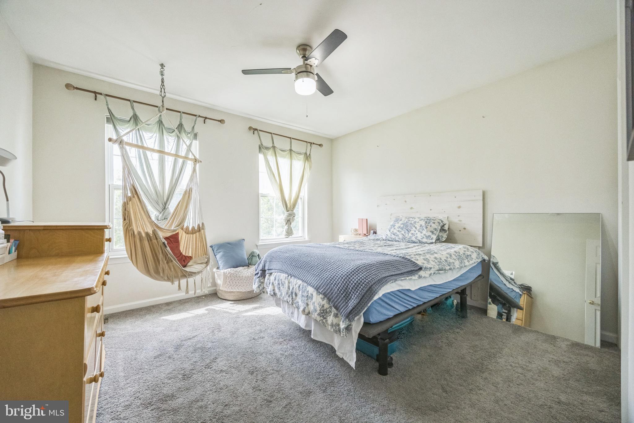 1 Elmwood Road Mount Laurel, NJ 08054 - Photo 23 of 44 a bedroom with a bed next to a window with the outer view
