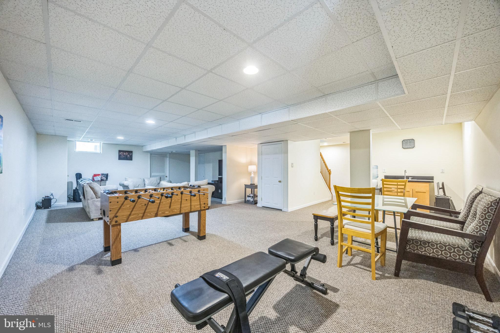 1 Elmwood Road Mount Laurel, NJ 08054 - Photo 30 of 44 a living room with furniture and a flat screen tv