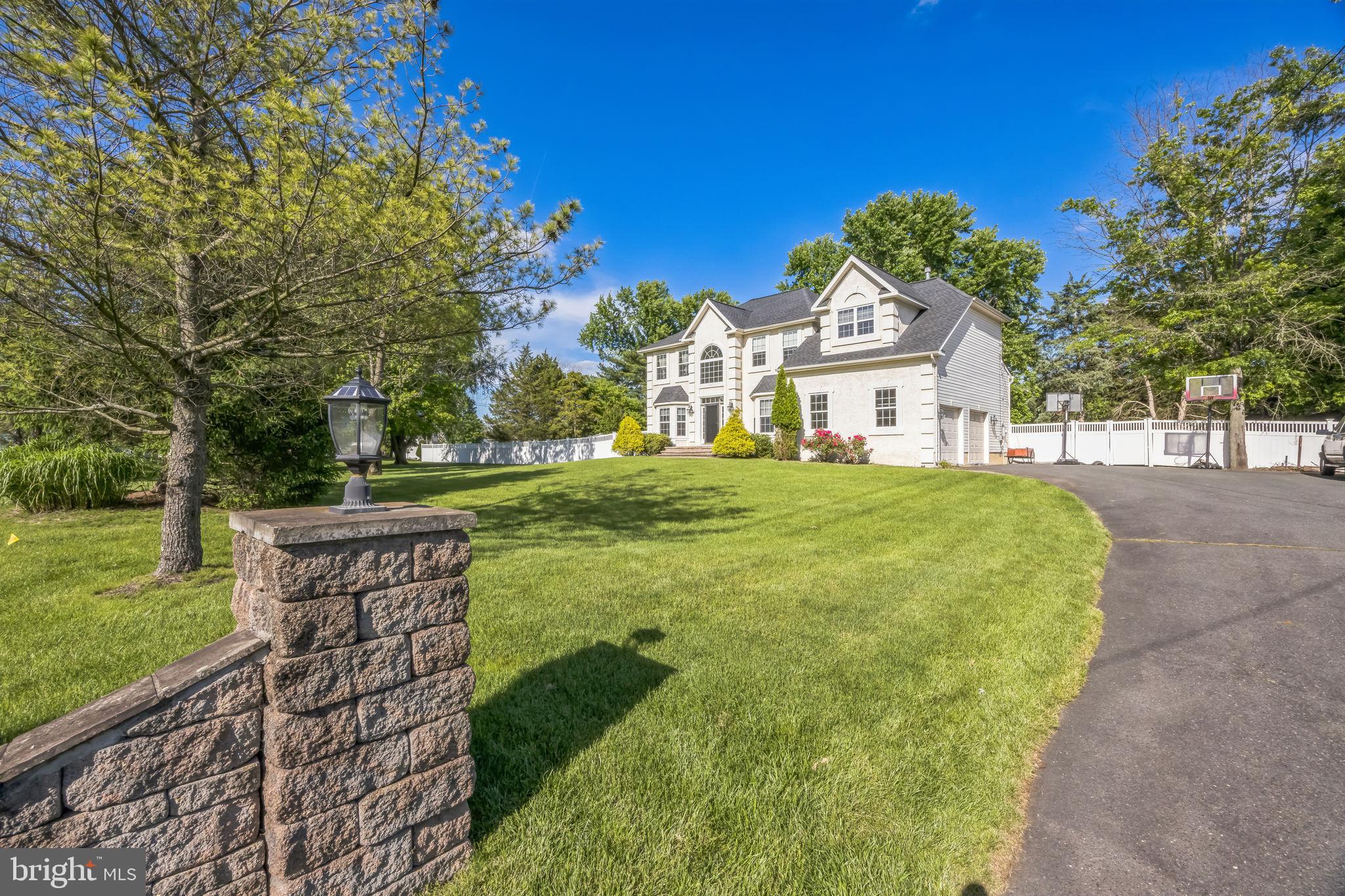 1 Elmwood Road Mount Laurel, NJ 08054 - Photo 3 of 44 a view of a house with a big yard and large trees
